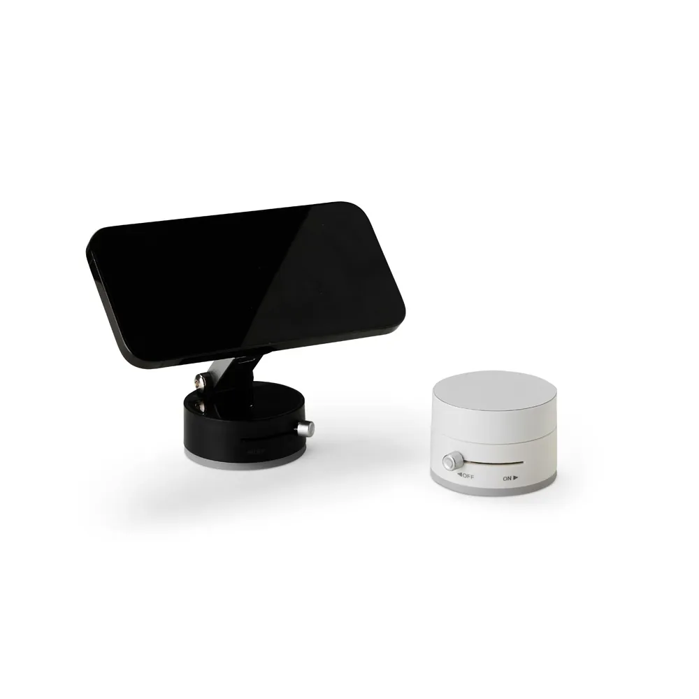 Suporte magnético Hub preto em uso com celular